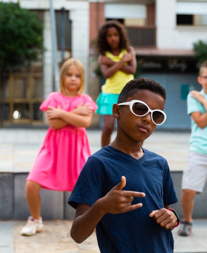 Children practising a dance routine outdoors